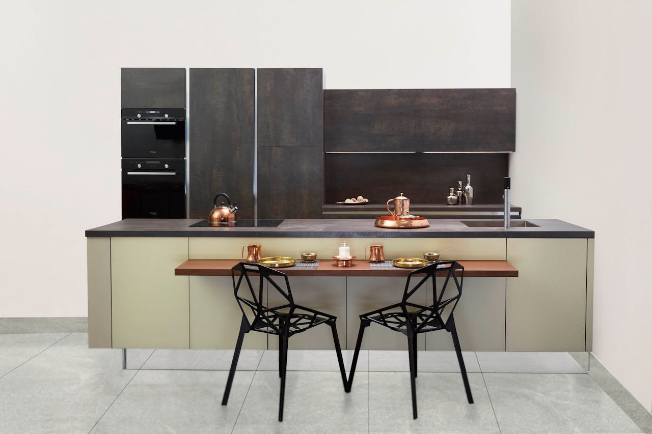 Elegant modern kitchen featuring copper accents and minimalist design.
